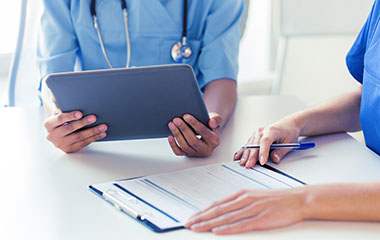 Doctor writing referral