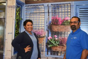 Asiah Diloi and Joe Fiorello with the colourful Cooinda Florist mural.