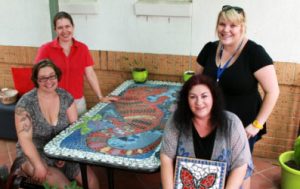 Patients and volunteers build table